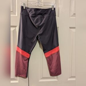 Under Armor pink and gray cropped leggings
